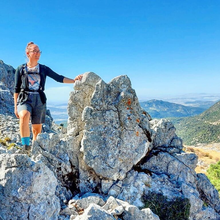 Licia standing on highest point of mountain